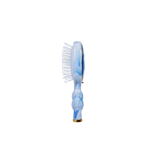 Marbled blue and white hairbrush on a white background