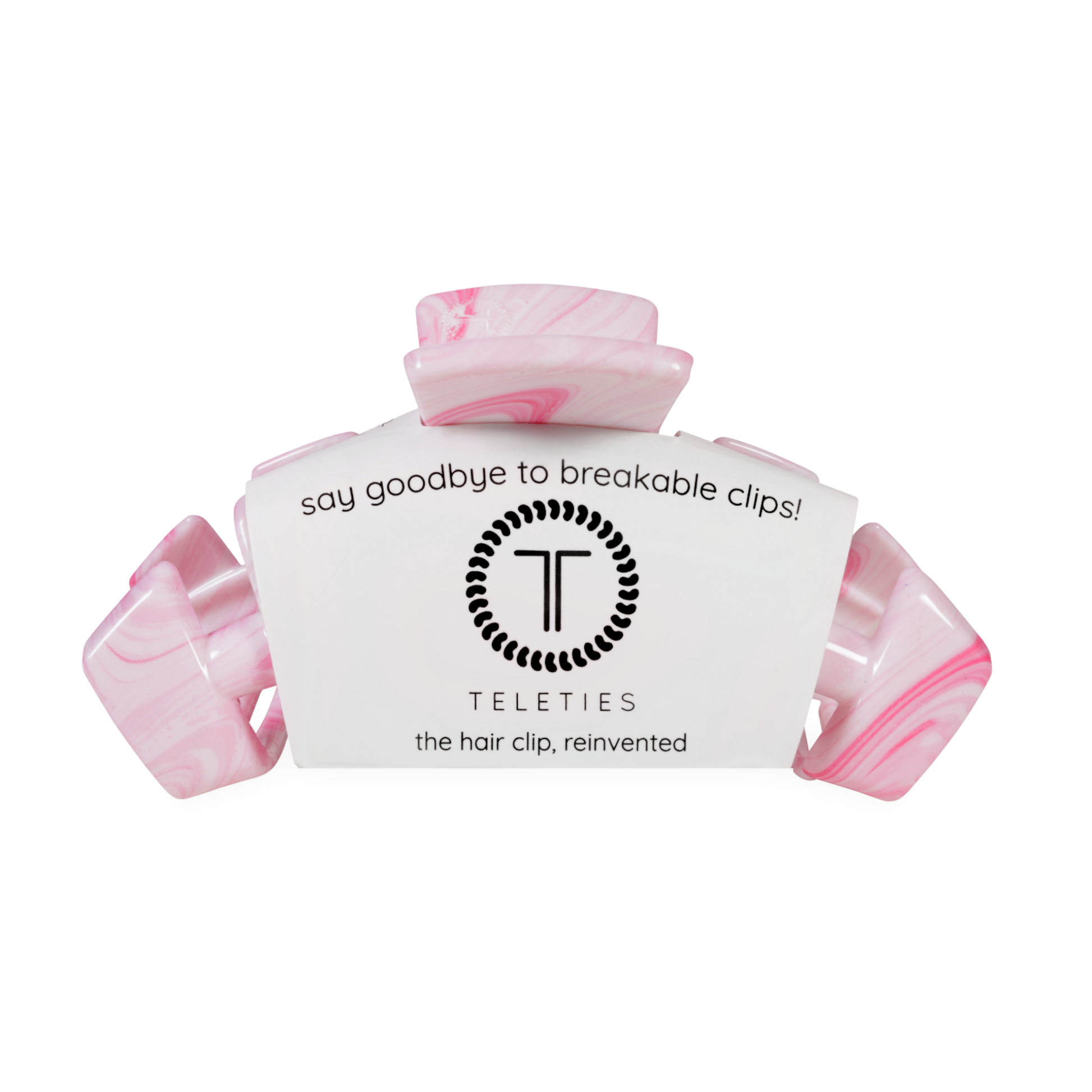 Pink hair clip with a teleties label on a white background