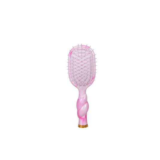Pink and gold paddle hairbrush on a white background