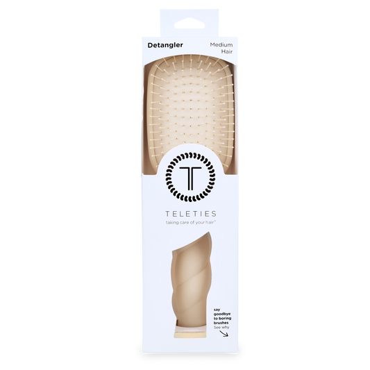 Teleties detangler brush packaging on a white background