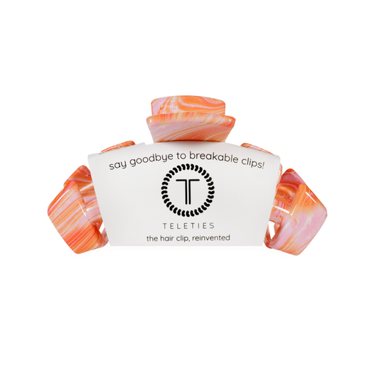 Marbled hair clip with 'Teleties' branding on a white background