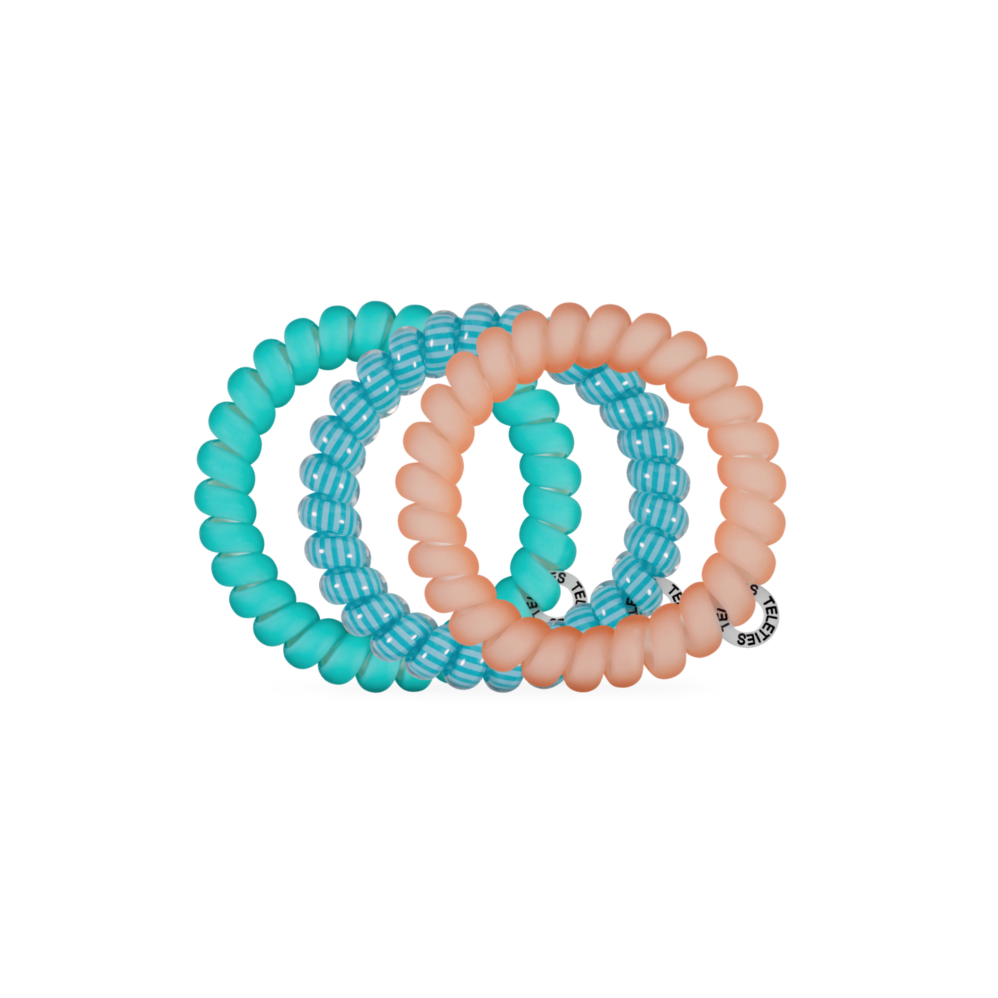 Set of three turquoise and peach-colored hair ties on a white background