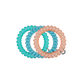 Set of three turquoise and peach-colored hair ties on a white background