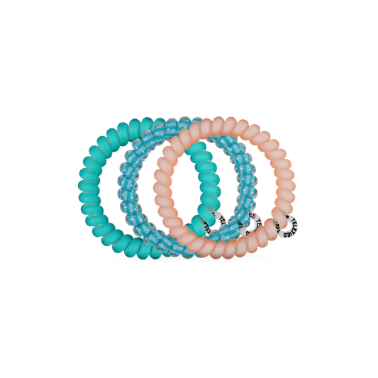 Set of turquoise and peach beaded bracelets on a white background